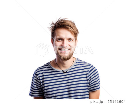 Boy in jeans and t-shirt, young man, studio shot Boy in jeans and t-shirt, young man, studio shot 25141604