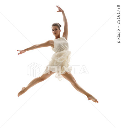 Beautiful ballerina posing in graceful leap Beautiful ballerina posing in graceful leap 25161739
