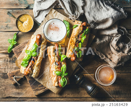 Wheat unfiltered beer and grilled sausage dogs in Wheat unfiltered beer and grilled sausage dogs in 25163429