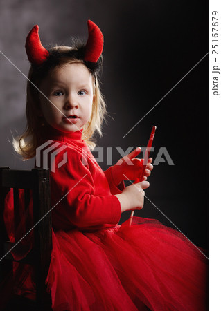 funny little devil on dark background funny little devil on dark background 25167879
