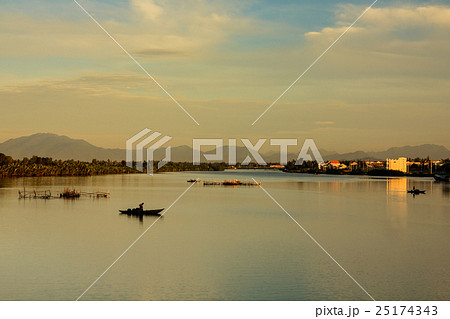 Fisherman is fishing in sunrise at Thu Bon river 25174343