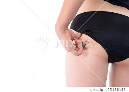 お尻の肉を指でつまむ女性 ダイエット ビューティイメージの写真素材
