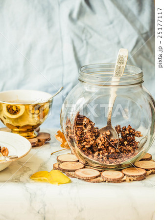 Homemade chocolate granola with banana, peanut Homemade chocolate granola with banana, peanut 25177117