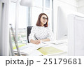 Smiling asian businesswoman working at office desk 25179681