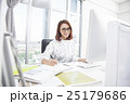 Smiling asian businesswoman working at office desk 25179686