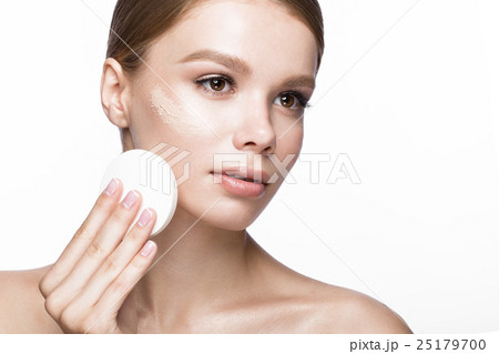 Beautiful young girl with sponge for application 25179700