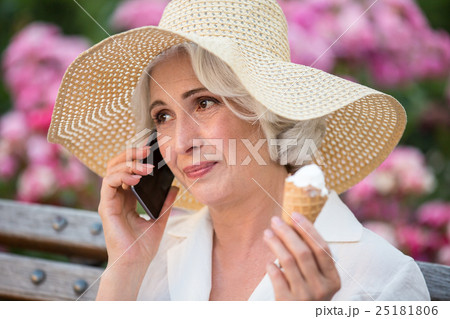 Mature woman with cell phone. 25181806