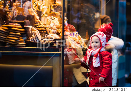 Kids looking at candy , pastry on Christmas market 25184014
