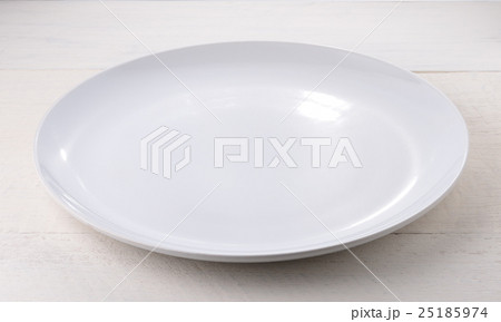 Empty ceramic plate on wooden table 25185974