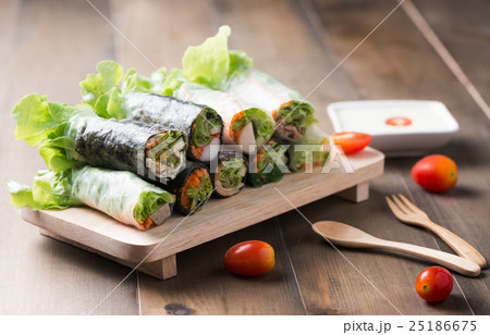 salad roll on wood plate 25186675