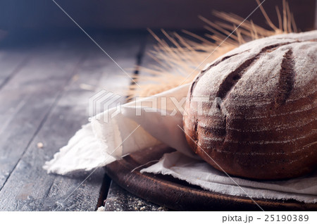 wheat and bread on a wooden table wheat and bread on a wooden table 25190389