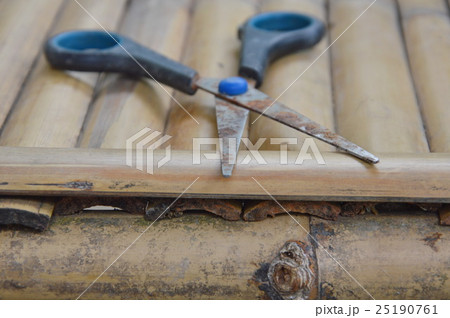 old rusty scissor on bamboo table old rusty scissor on bamboo table 25190761