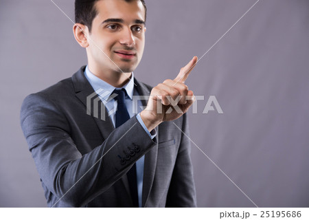 Businessman pressing buttons in business concept Businessman pressing buttons in business concept 25195686