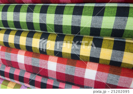 Traditional clothes are sold in shop in Myanmar. 25202095