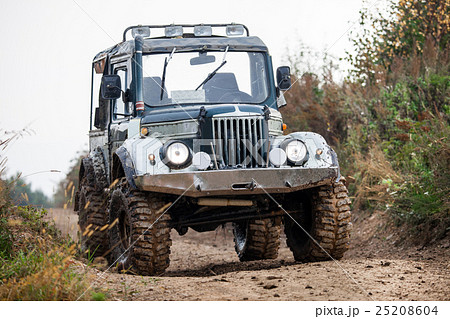 Retro style off-road car on a road Retro style off-road car on a road 25208604