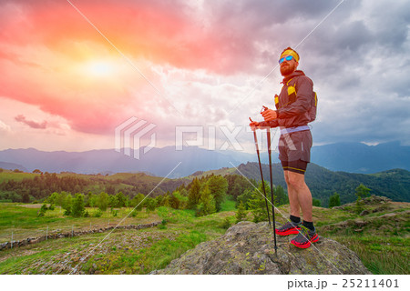 Man resting on top of the mountain during the practice of trail 25211401