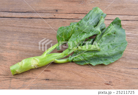 chinese broccoli on wood background chinese broccoli on wood background 25211725