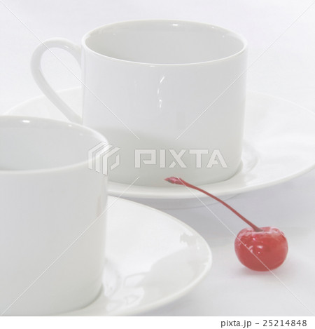 Cup of coffee with red cherry on white background Cup of coffee with red cherry on white background 25214848