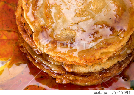 pancakes with maple syrup on autumn leaves pancakes with maple syrup on autumn leaves 25215091
