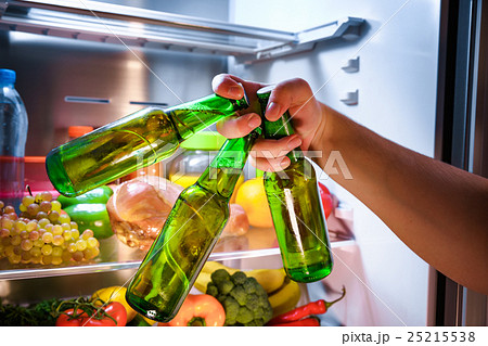 Man taking beer from a fridge 25215538