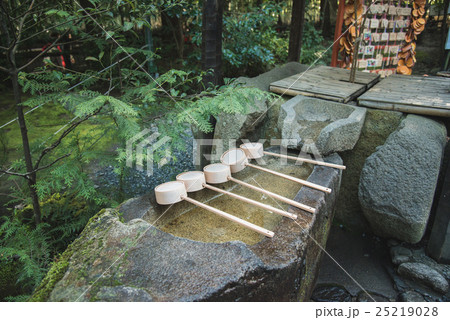 ladle on bamboo in japanese shrine 25219028