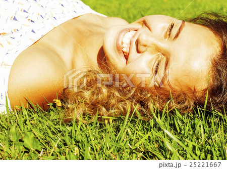 young cute summer girl on green grass outside young cute summer girl on green grass outside 25221667
