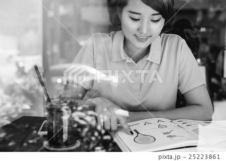 Asian Woman Reading Tennis Skills Book Concept Asian Woman Reading Tennis Skills Book Concept 25223861