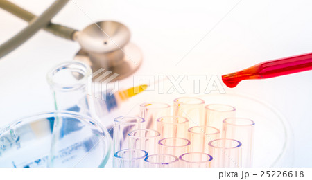 laboratory test tubes,medical glassware, Stethoscope,plastic syringe . ( Filtered image processed colorful effect. ) 25226618