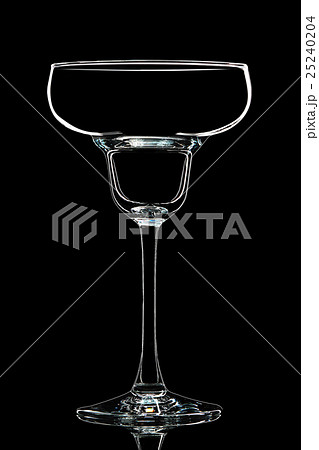Silhouette of white margarita glass on black 25240204