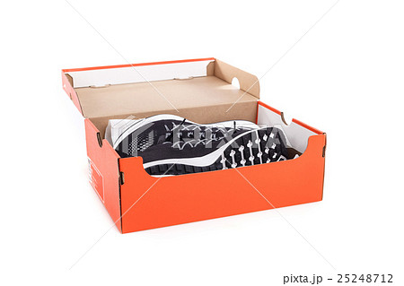 New black sneakers shoes in box. Taken at studio and isolated over white New black sneakers shoes in box. Taken at studio and isolated over white 25248712