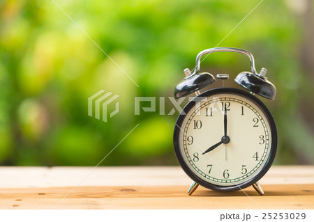 retro clock in green garden at 8 o'clock retro clock in green garden at 8 o'clock 25253029