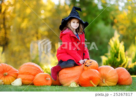 Adorable little girl playing with paper moustache 25267817