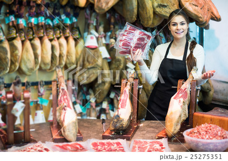 butcher with lard and meat in counter of store butcher with lard and meat in counter of store 25275351