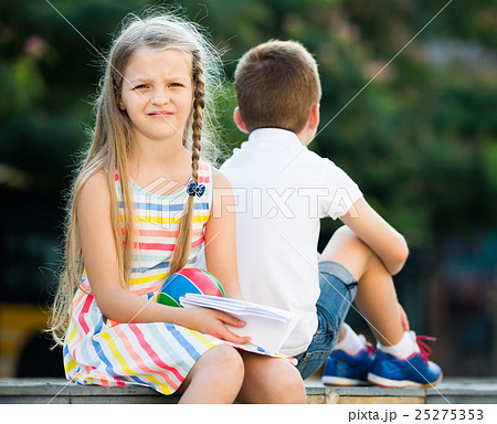 disappointed girl in having problem with friend outdoors in park disappointed girl in having problem with friend outdoors in park 25275353
