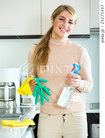 Tired young woman in rubber gloves 25275437