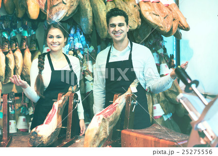 Two workers selling jamon Two workers selling jamon 25275556