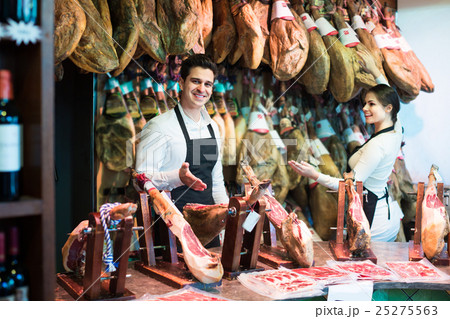 Two workers selling jamon Two workers selling jamon 25275563