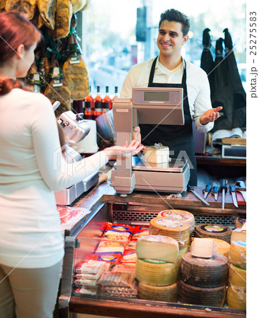 Customer buying cheese for dessert 25275583