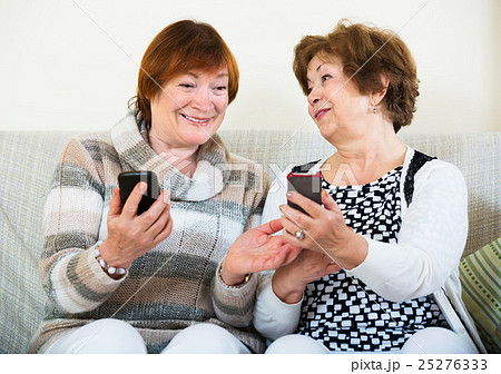 Senior women with mobile phones Senior women with mobile phones 25276333