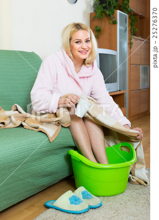 Blonde taking foot bath at home 25276370
