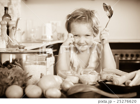 Baby girl cooking with meat 25276620