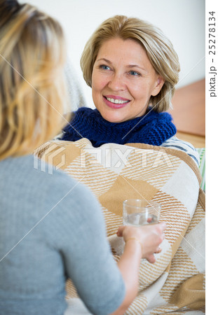 Portrait of sick female pensioner and her careful daughter 25278134