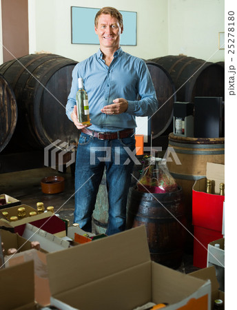 happy male customer buying bottle of wine happy male customer buying bottle of wine 25278180