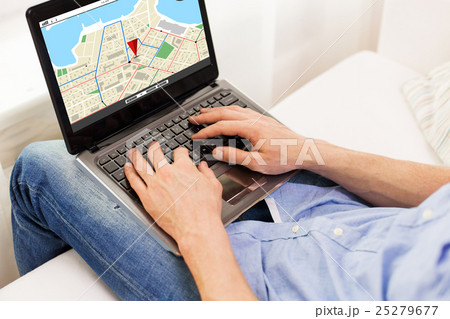 close up of man typing on laptop computer at home close up of man typing on laptop computer at home 25279677