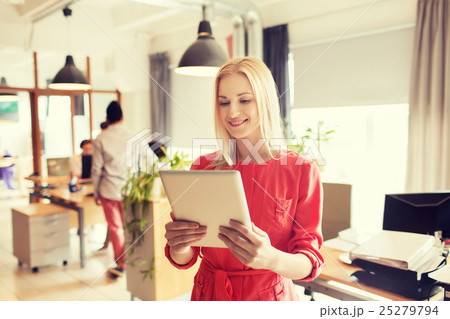 happy creative female office worker with tablet pc happy creative female office worker with tablet pc 25279794