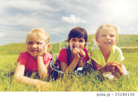 group of kids lying on blanket or cover outdoors group of kids lying on blanket or cover outdoors 25280130