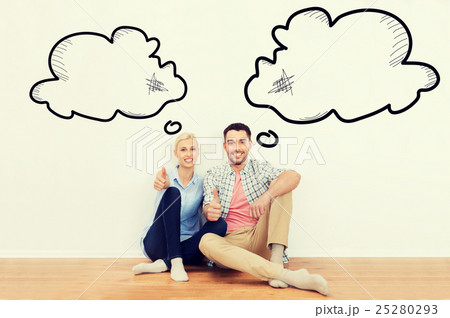 happy couple showing thumbs up at new home happy couple showing thumbs up at new home 25280293