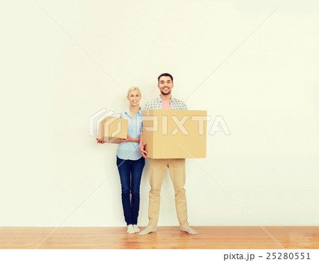 couple with cardboard boxes moving to new home 25280551