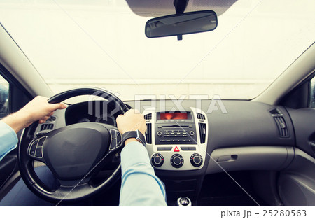 close up of young man driving car 25280563