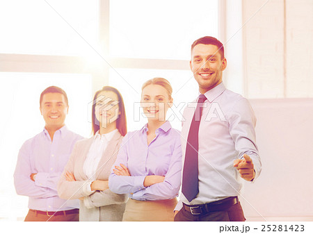 businessman in office pointing finger at you 25281423